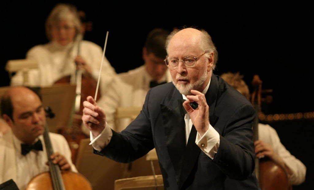 Image shows composer John Williams conducting one of his many pieces.