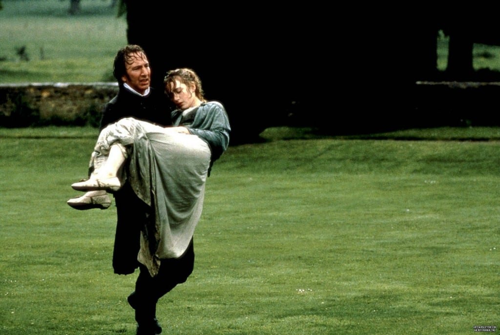 Alan RIckman carries a discheveled Kate Winslet through a grassy field