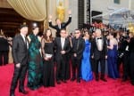Pictured is the Oscars 2014 red carpet ceremony, where the actor Benedict Cumberbatch is jumping behind the band U2, photobombing them.