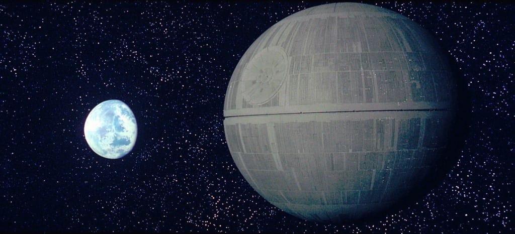 Image shows a large circular space station, the Death Star from the film, Star Wars