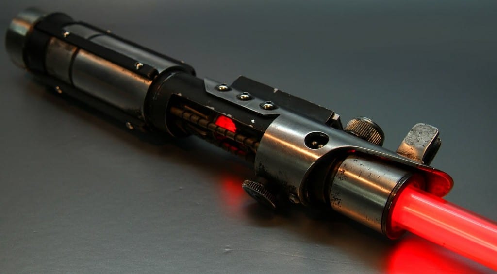 Image shows a red glowing lightsaber from the movie Star Wars