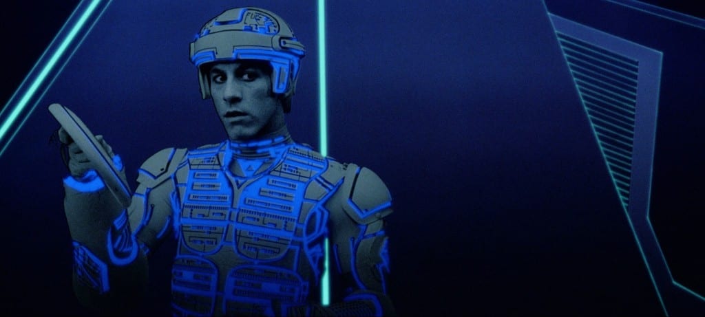 Image shows a character from the movie Tron, holding an identity disc. 