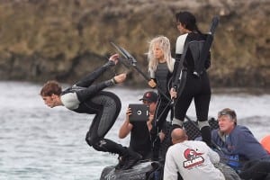 Sam Claflin diving into the ocean while filming a scene with Jennifer Lawrence in Hawaii for The Hunger Games: Catching Fire.