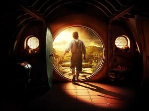 Bilbo the Hobbit walking out of his front door as sun streams in to his house.