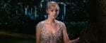Carey Mulligan as Daisy Buchanan looks into the distance wearing a stunning crystal Prada dress and Tiffany & Co headpiece