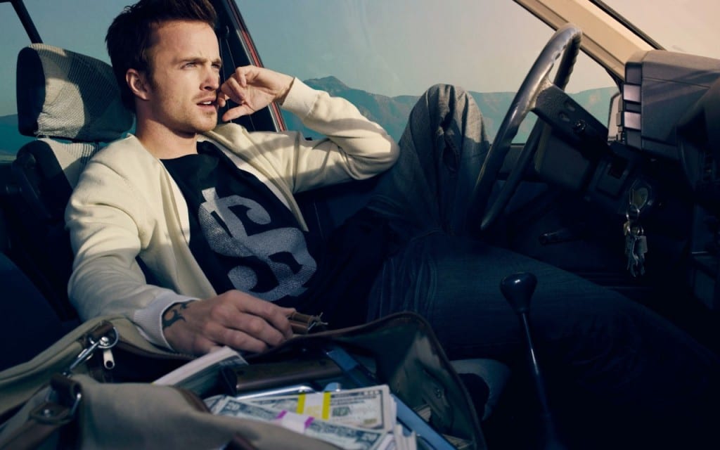 Aaron Paul's character Tobey Marshall sat in a car.